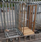 Two metal transport trolleys / cages on wheels (outside)