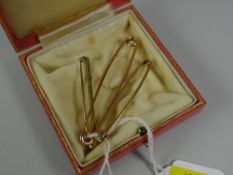Three boxed 9ct gold tie pins, approx. 7.3grms