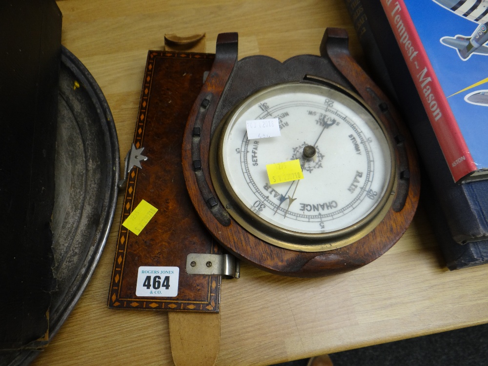 A vintage inlaid wood tie press together with a horseshoe shaped barometer