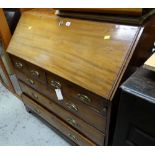 An antique light mahogany drop down bureau, two short & three long drawers with brass fittings