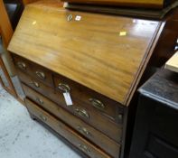 An antique light mahogany drop down bureau, two short & three long drawers with brass fittings