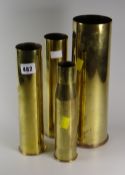 Four brass artillery shells