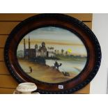 Vintage oval carved mahogany framed oil on card of a Middle Eastern riverbank scene