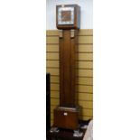 A 1950s oak cased grandmother clock