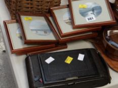 A vintage camera & set of seven framed miniature watercolours