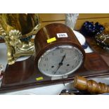 An early twentieth century mahogany Napoleon's hat mantel clock by Enfield with hallmarked silver