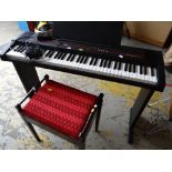 A Roland EP-77 electric piano together with piano stool