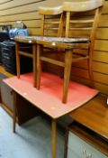 A vintage Formica-topped kitchen table together with two matching chairs