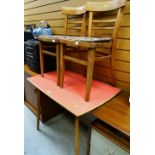 A vintage Formica-topped kitchen table together with two matching chairs