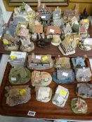 Two trays of various make resin model cottages, buildings etc
