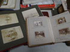 Two vintage photograph albums together with an early twentieth century sketchbook