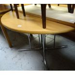 A modern circular lightwood & chrome leg dining table