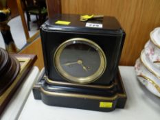 A black marble, gilt & brass decorated mantel clock