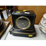 A black marble, gilt & brass decorated mantel clock
