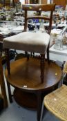 A circular mahogany coffee table with lower shelf & fretwork decoration together with a mahogany