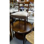 A circular mahogany coffee table with lower shelf & fretwork decoration together with a mahogany