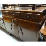 A vintage oak railback sideboard with carved decoration to drawers & centre panel