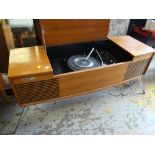 A teak Deccalian 12 vintage radiogram with a Garrard turntable together with a cabinet of LP