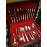 A wooden cased set of Oneida cutlery