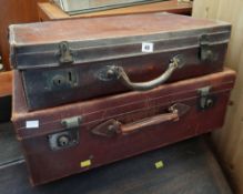 Two vintage brown leather suitcases