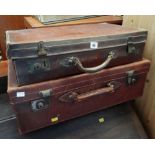 Two vintage brown leather suitcases