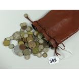 A small leather bag containing many coins including silver content etc