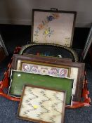 A crate of various decorated & embroidered trays
