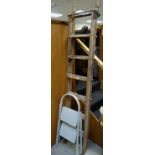 A set of vintage tall wooden step ladders by Crossley & a modern small metal two-step ladder