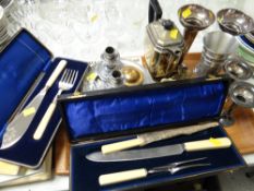 Tray of various metalware including boxed fish servers, carving set, trumpet vases etc