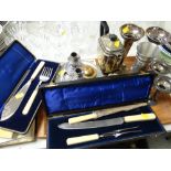 Tray of various metalware including boxed fish servers, carving set, trumpet vases etc