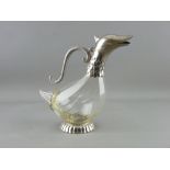 A DUCK SHAPED CLARET JUG with plated metal mounts, 25 cms high