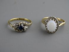 TWO GOLD DRESS RINGS, an eighteen carat and platinum crossover with central blue sapphire and