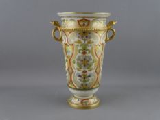 A NORITAKE PORCELAIN TWIN HANDLED VASE, 19.75 cms high