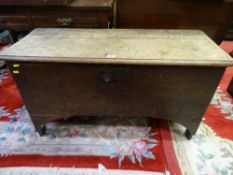 AN ANTIQUE OAK SWORD CHEST, seven plank construction with iron strap lock and pin hinges, 56.5 cms
