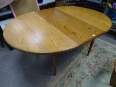 A G-PLAN STYLE TEAK EXTENDING DINING TABLE, 73 cms high, 166 cms long approximately fully