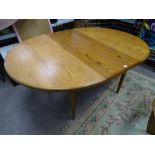 A G-PLAN STYLE TEAK EXTENDING DINING TABLE, 73 cms high, 166 cms long approximately fully