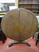 A VICTORIAN MAHOGANY CIRCULAR TOPPED LOO TABLE on a square segmented column to a platform base and