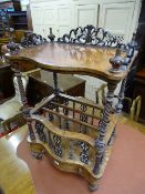 A WALNUT CANTERBURY WHATNOT having a shaped upper shelf with bobbin and carved gallery etc and
