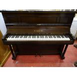 A MAHOGANY VINTAGE UPRIGHT PIANO, 115 cms high, 140 cms wide, 54 cms deep