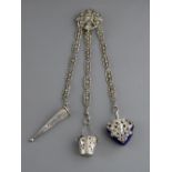 A CONTINENTAL WHITE METAL THREE STRAND CHATELAINE with scissor sleeve, bucket shaped thimble