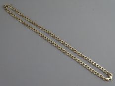 A NINE CARAT GOLD CURB BRACELET, 13.5 grms