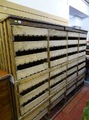 A SEMI BUILT-IN EARLY 20th CENTURY RACK OF THIRTY SIX FRUIT STORAGE DRAWERS, date letters to top