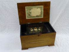 A 19th CENTURY SWISS CYLINDER MUSIC BOX with 16 cms brass cylinder and bells in view playing