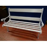 A WELL PRESENTED GARDEN BENCH with cast iron ends, 80 cms high, 124.5 cms wide, 70 cms deep