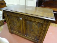 A NEAT REPRODUCTION CARVED OAK LIDDED BLANKET CHEST, 54 cms high, 76 cms wide, 45 cms deep