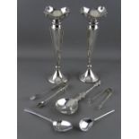 A PAIR OF SILVER TRUMPET VASES and a parcel of spoons and sugar tongs, the apostle spoon marked