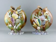A PAIR OF CONTINENTAL MAJOLICA SHELL ENCRUSTED MOON SHAPED VASES, 31 cms high (losses and