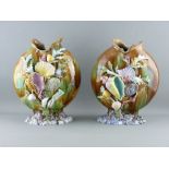 A PAIR OF CONTINENTAL MAJOLICA SHELL ENCRUSTED MOON SHAPED VASES, 31 cms high (losses and