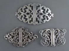 THREE SILVER NURSE'S BUCKLES, hallmarks for London 1973, Birmingham 1968 and a Continental example