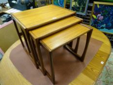 A G-PLAN SET OF THREE OCCASIONAL TABLES, 49 cms high, 53 cms wide, 43 cms deep the largest